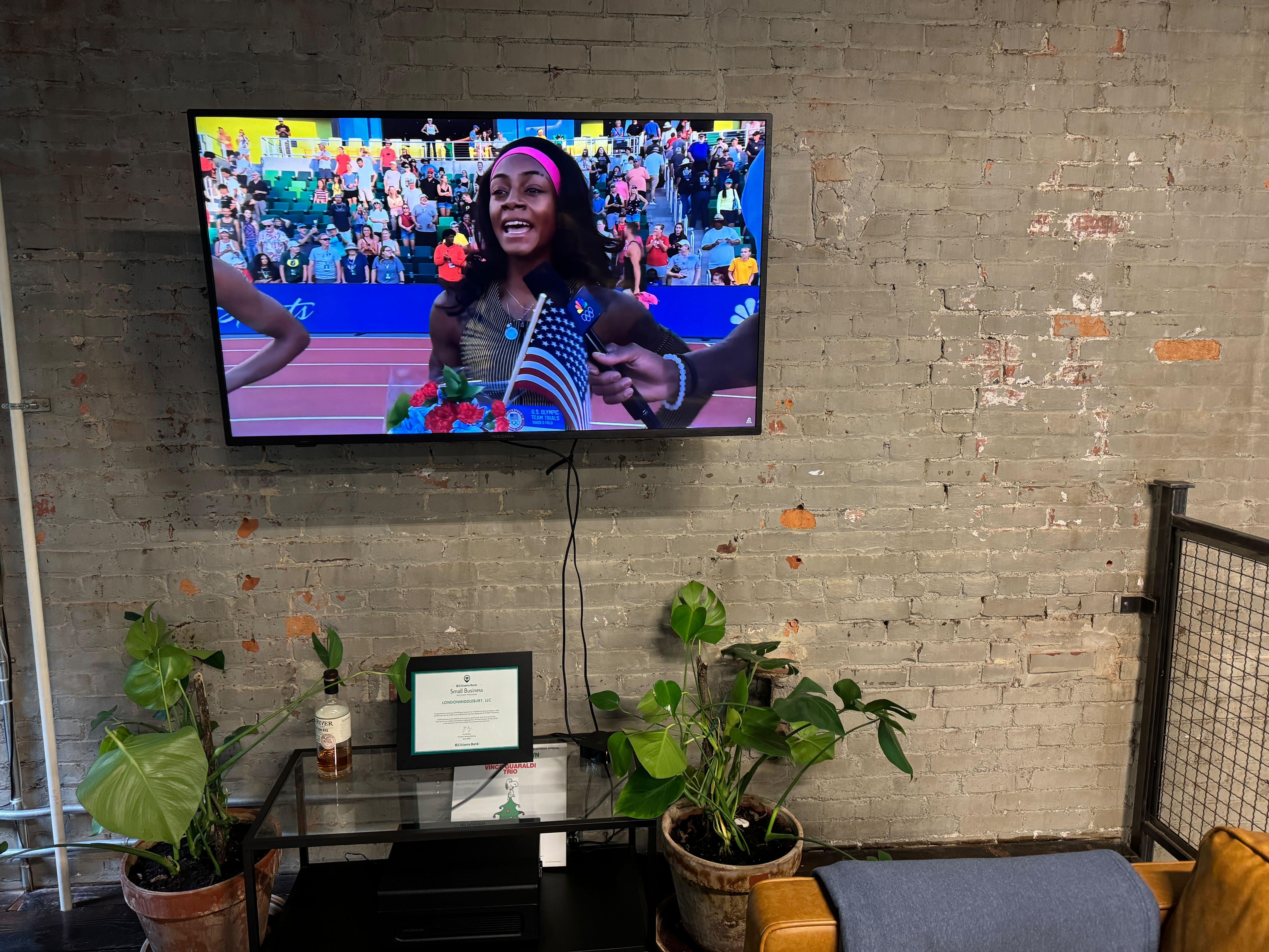 An Olympic event playing on the office TV.